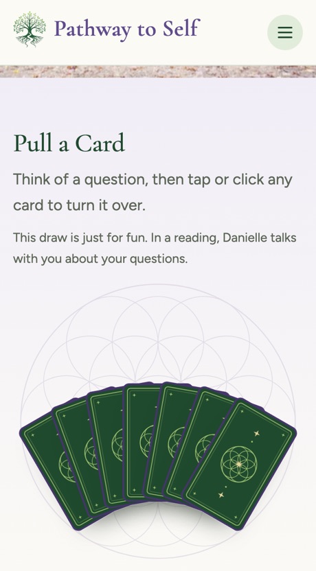 The Pull a Card section on a phone, with seven cards fanned face down over the Flower of Life