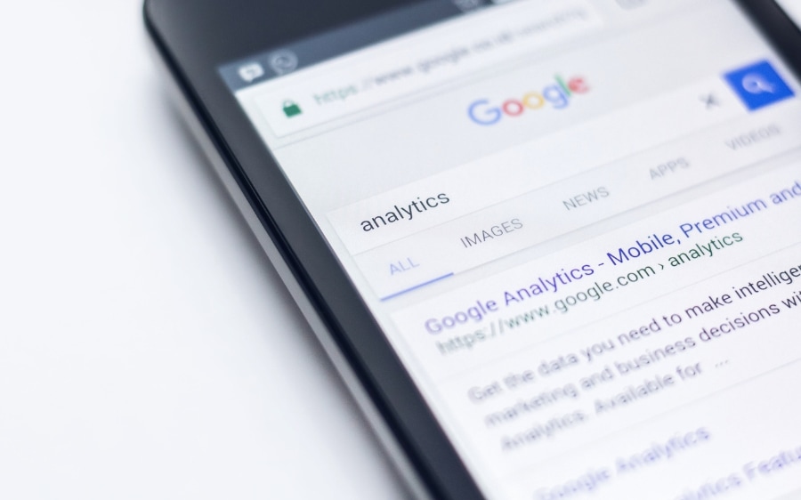 A phone open to a Google search results page